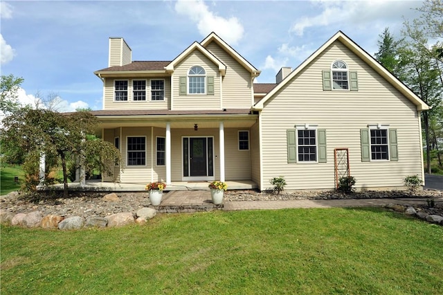 90 Davenport Rd, Big Flats, NY 14814 - view of front of property featuring a chimney, a front lawn, and a porch