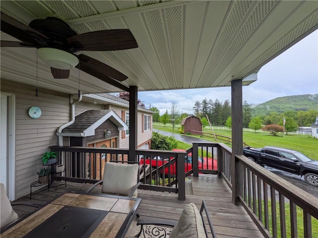 1405 W Main St, Smethport-Borough, PA 16749 - wooden deck featuring an outdoor structure, a mountain view, ceiling fan, and a barn