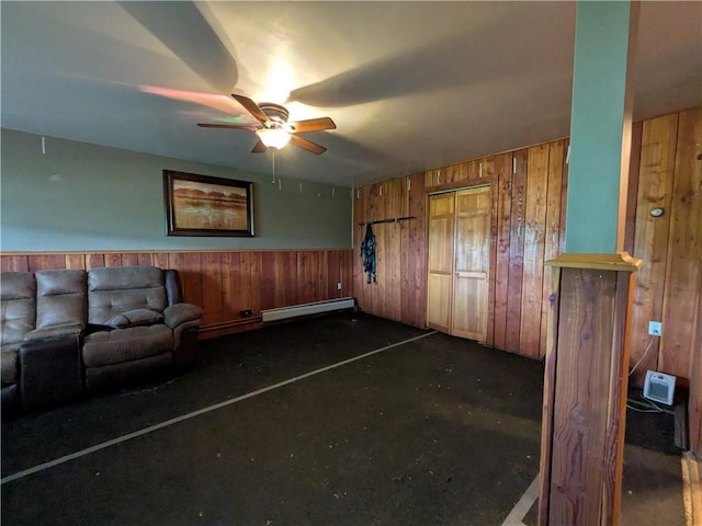 1405 W Main St, Smethport-Borough, PA 16749 - living room featuring a baseboard radiator, wooden walls, a ceiling fan, and a wainscoted wall
