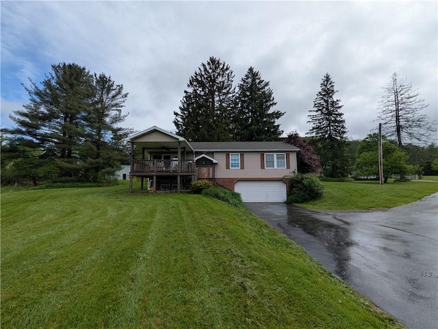 1405 W Main St, Smethport-Borough, PA 16749 - split foyer home with asphalt driveway, an attached garage, a front yard, and a deck