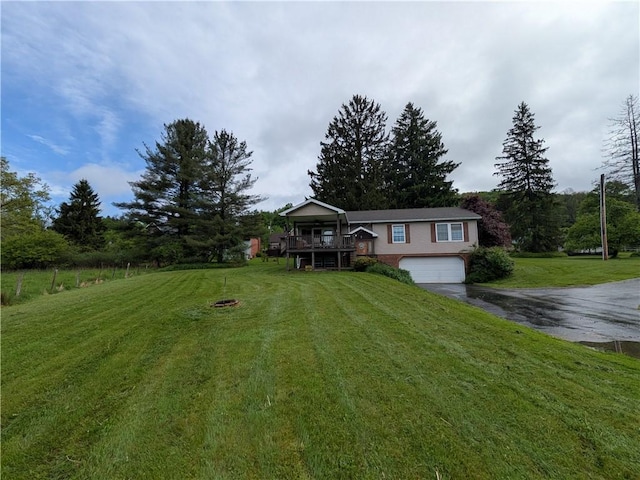 1405 W Main St, Smethport-Borough, PA 16749 - view of front facade with driveway, an attached garage, a front yard, and a wooden deck