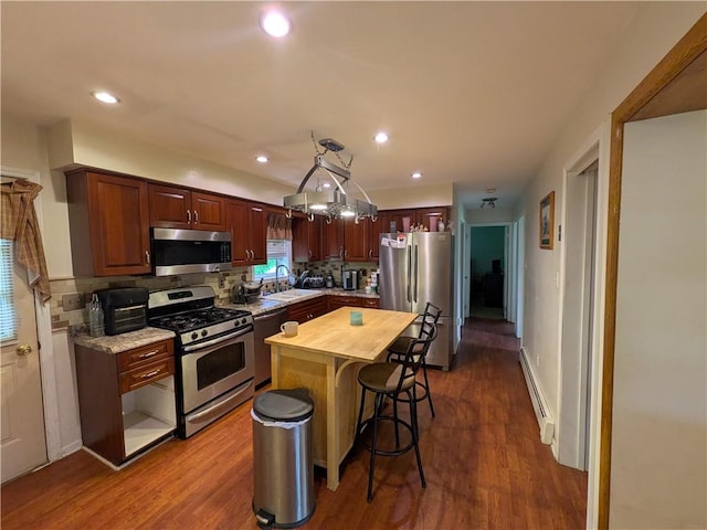 1405 W Main St, Smethport-Borough, PA 16749 - kitchen featuring appliances with stainless steel finishes, a baseboard heating unit, a sink, decorative backsplash, and recessed lighting