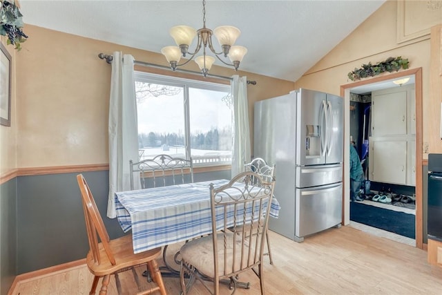 4231 Cauwels Rd, Arcadia, NY 14505 - dining room with a chandelier, light wood-type flooring, and lofted ceiling