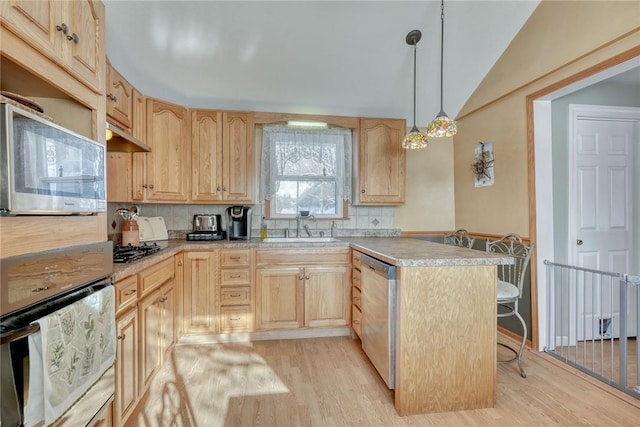 4231 Cauwels Rd, Arcadia, NY 14505 - kitchen with appliances with stainless steel finishes, light brown cabinets, a peninsula, a kitchen bar, and lofted ceiling