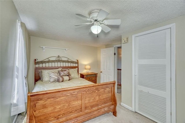 4231 Cauwels Rd, Arcadia, NY 14505 - carpeted bedroom with a textured ceiling, a ceiling fan, and a closet