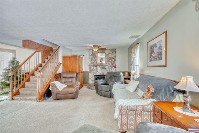 4231 Cauwels Rd, Arcadia, NY 14505 - living room with carpet flooring, stairway, a ceiling fan, and a textured ceiling