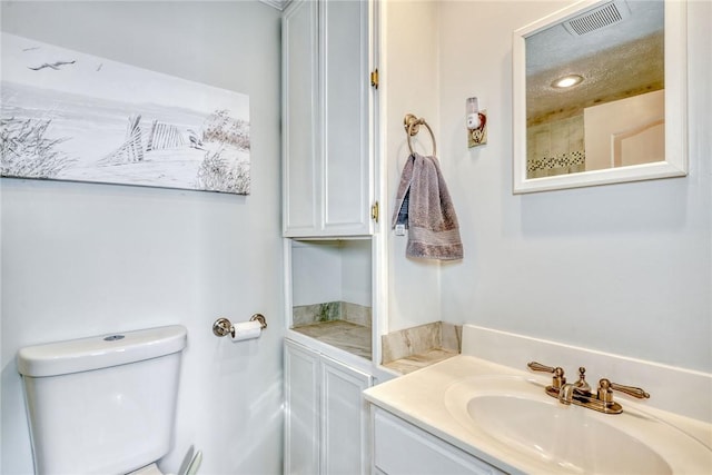 4231 Cauwels Rd, Arcadia, NY 14505 - bathroom featuring vanity, toilet, and recessed lighting