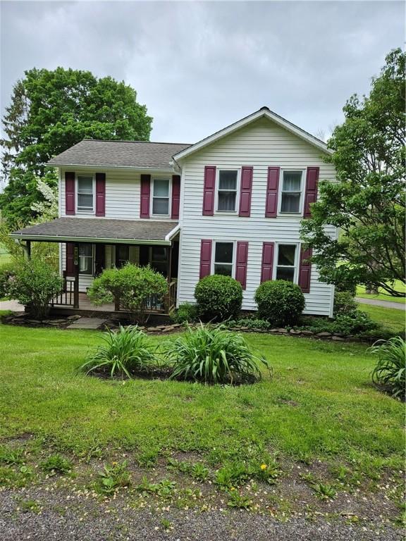 4231 Cauwels Rd, Arcadia, NY 14505 - view of front of property featuring a front yard and a porch