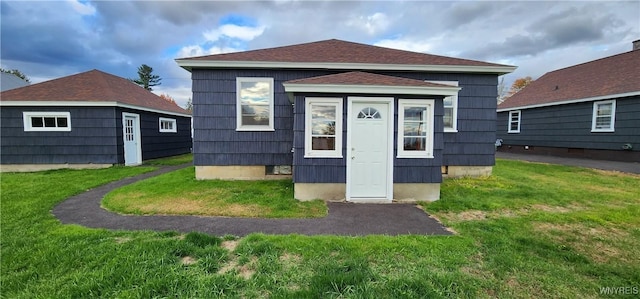 925 Calvert St, Rome-Inside, NY 13440 - rear view of property featuring a lawn and an outbuilding