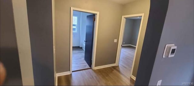925 Calvert St, Rome-Inside, NY 13440 - hallway with wood finished floors and baseboards