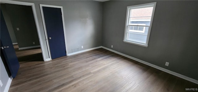 925 Calvert St, Rome-Inside, NY 13440 - unfurnished room with baseboards and wood finished floors