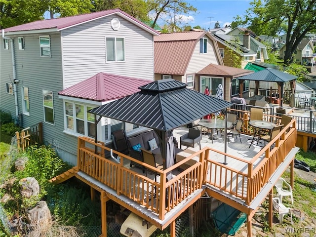 328 Lakeview Blvd, Machias, NY 14042 - rear view of property with metal roof, a deck, and outdoor dining area