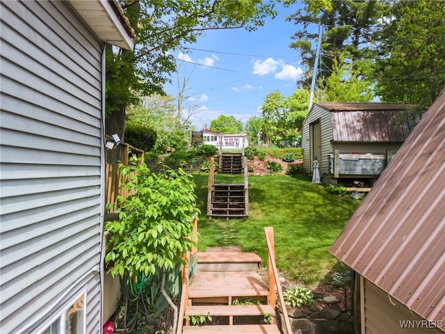 328 Lakeview Blvd, Machias, NY 14042 - view of grassy yard featuring a storage shed, an outbuilding, and stairs