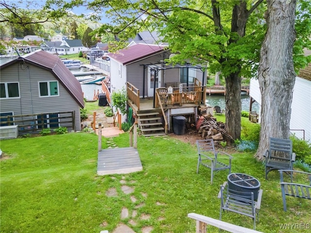 328 Lakeview Blvd, Machias, NY 14042 - view of green lawn with a deck with water view