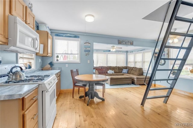 328 Lakeview Blvd, Machias, NY 14042 - kitchen with white appliances, ceiling fan, light wood-style floors, baseboards, and open floor plan