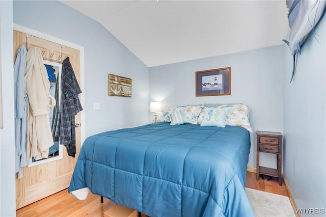 328 Lakeview Blvd, Machias, NY 14042 - bedroom featuring lofted ceiling, wood finished floors, and baseboards