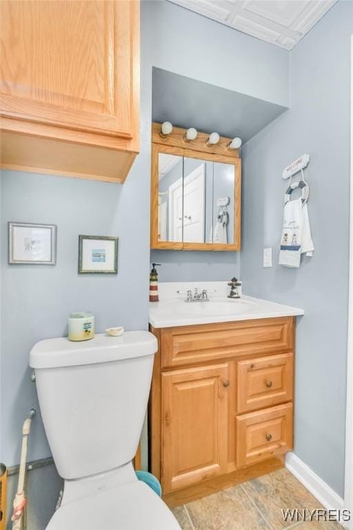328 Lakeview Blvd, Machias, NY 14042 - bathroom with toilet, vanity, and baseboards