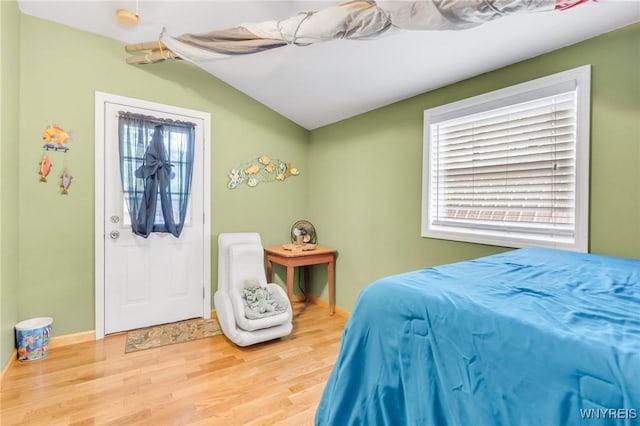 328 Lakeview Blvd, Machias, NY 14042 - bedroom featuring wood finished floors, lofted ceiling, and baseboards