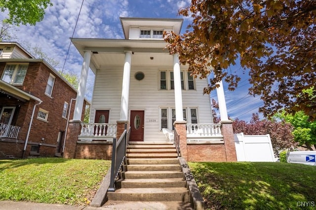 1628 Mohawk St, Utica, NY 13501 - view of front of home with a porch and a front yard