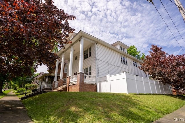 1628 Mohawk St, Utica, NY 13501 - view of side of home featuring a porch