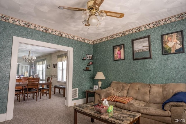 1628 Mohawk St, Utica, NY 13501 - living room featuring a chandelier, carpet floors, ceiling fan, and wallpapered walls