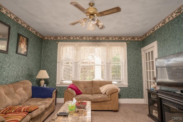 1628 Mohawk St, Utica, NY 13501 - living room with wallpapered walls, ceiling fan, carpet flooring, and baseboards