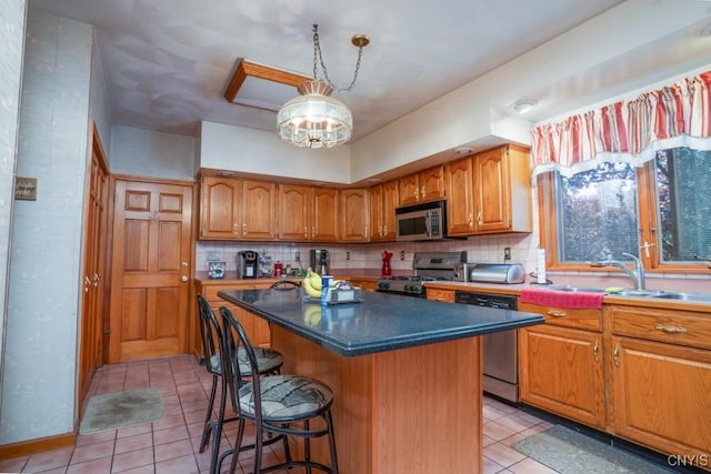 1628 Mohawk St, Utica, NY 13501 - kitchen with stainless steel appliances, light tile patterned flooring, brown cabinetry, a kitchen breakfast bar, and a kitchen island