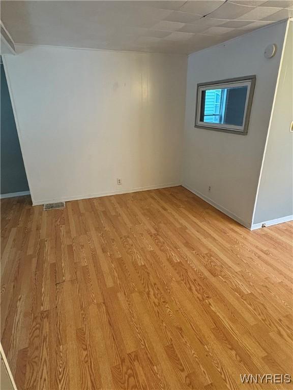 68 Decker St, Buffalo, NY 14215 - spare room with light wood-style floors and baseboards