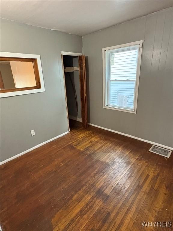 68 Decker St, Buffalo, NY 14215 - unfurnished bedroom with wood finished floors and baseboards