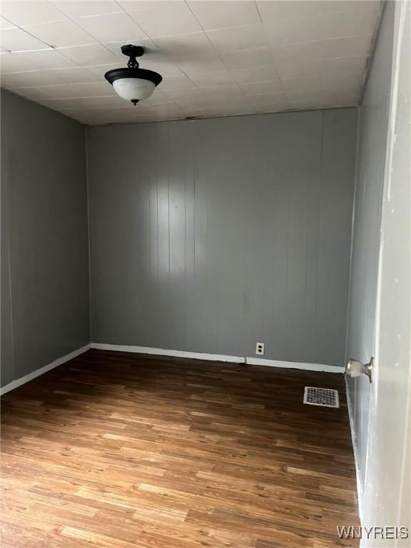 68 Decker St, Buffalo, NY 14215 - spare room featuring baseboards and wood finished floors