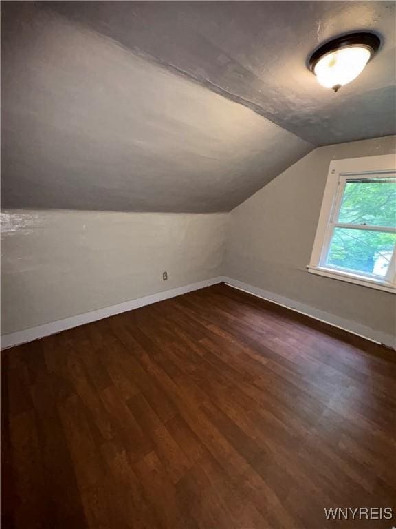 68 Decker St, Buffalo, NY 14215 - additional living space with dark wood finished floors and vaulted ceiling
