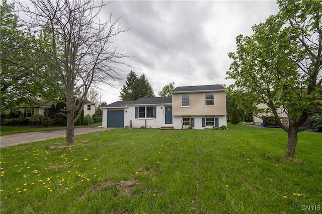 5646 Vistula, Cicero, NY 13029 - tri-level home featuring asphalt driveway, an attached garage, and a front lawn