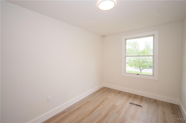 5646 Vistula, Cicero, NY 13029 - unfurnished room with baseboards and light wood-style flooring