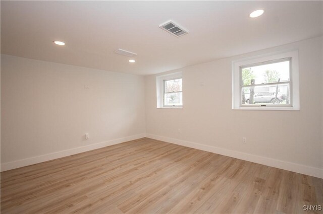5646 Vistula, Cicero, NY 13029 - unfurnished room featuring healthy amount of natural light, baseboards, light wood-style flooring, and recessed lighting