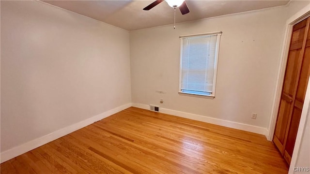 unfurnished bedroom with baseboards, light wood-style flooring, and ceiling fan