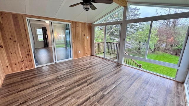 unfurnished sunroom with ceiling fan and lofted ceiling