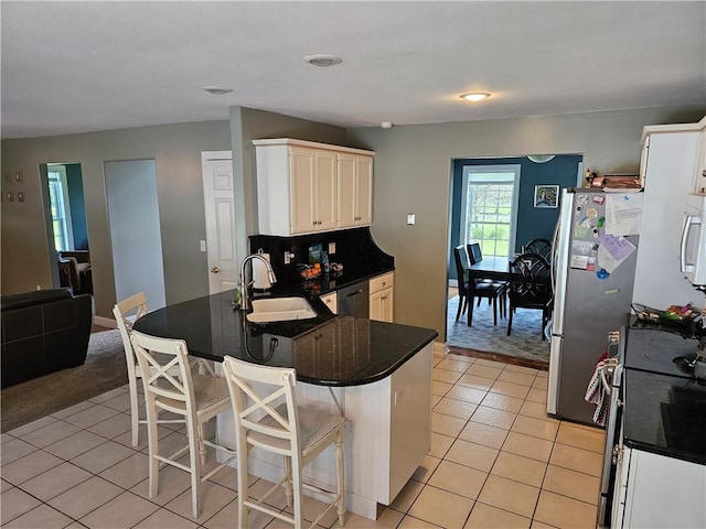 1 Woodsview Dr, Big Flats, NY 14903 - kitchen featuring a sink, light tile patterned flooring, a peninsula, and dark countertops