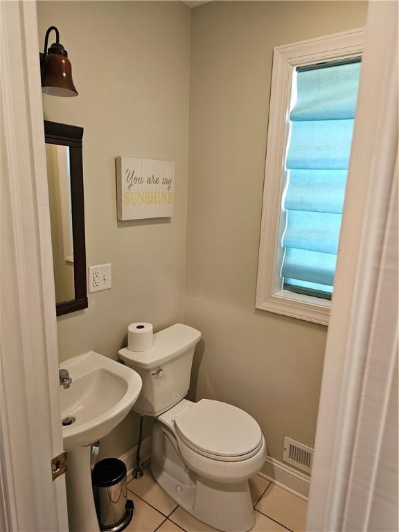 1 Woodsview Dr, Big Flats, NY 14903 - bathroom featuring tile patterned floors, toilet, and baseboards