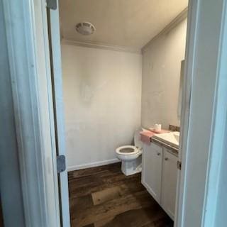 3384 Huggins Rd, Tyrone, NY 14815 - bathroom featuring ornamental molding, vanity, wood finished floors, and toilet