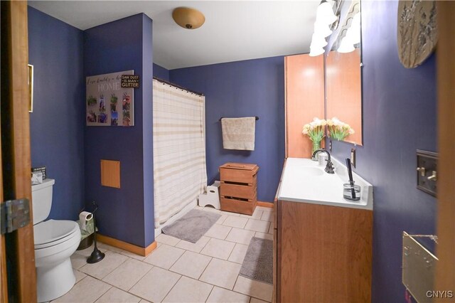 161 Mcclure Rd, Salisbury, NY 13470 - bathroom with toilet, vanity, baseboards, and tile patterned floors