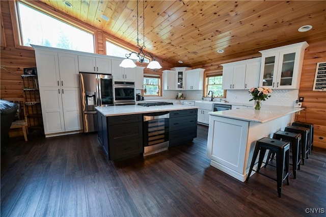 161 Mcclure Rd, Salisbury, NY 13470 - kitchen featuring wine cooler, appliances with stainless steel finishes, wood ceiling, white cabinetry, and glass insert cabinets