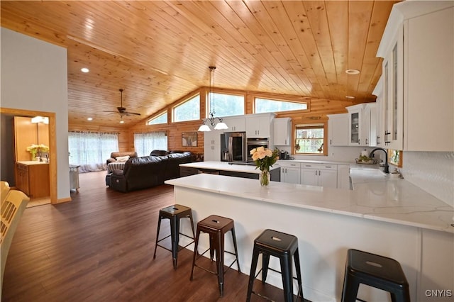 161 Mcclure Rd, Salisbury, NY 13470 - kitchen with stainless steel appliances, a sink, wood ceiling, vaulted ceiling, and a peninsula