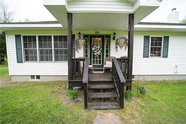 161 Mcclure Rd, Salisbury, NY 13470 - view of exterior entry with a yard and covered porch