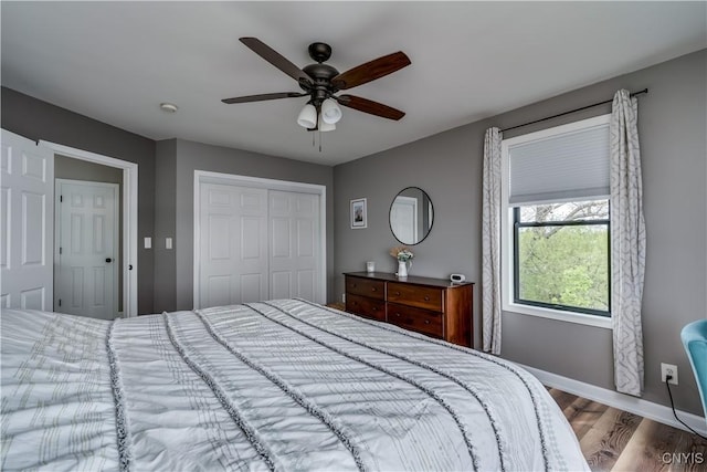 17695 County Route 59, Brownville, NY 13634 - bedroom featuring wood finished floors, a closet, baseboards, and ceiling fan