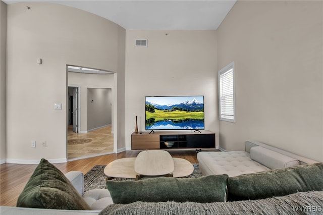 185 York St Unit 1, Buffalo, NY 14213 - living room with wood finished floors, a towering ceiling, and baseboards