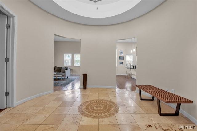 185 York St Unit 1, Buffalo, NY 14213 - hall with a towering ceiling, light tile patterned floors, and baseboards