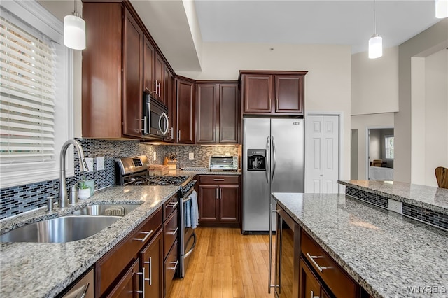 185 York St Unit 1, Buffalo, NY 14213 - kitchen with appliances with stainless steel finishes, a sink, beverage cooler, and light stone counters