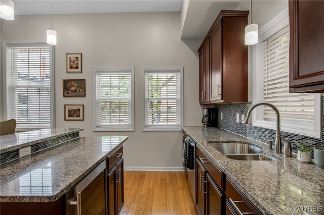 185 York St Unit 1, Buffalo, NY 14213 - kitchen featuring a sink, baseboards, decorative backsplash, beverage cooler, and light wood-style floors