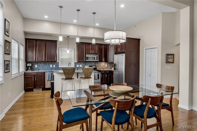185 York St Unit 1, Buffalo, NY 14213 - dining space with light wood-type flooring, baseboards, and recessed lighting