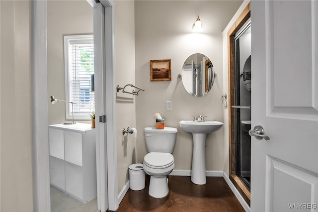 185 York St Unit 1, Buffalo, NY 14213 - bathroom featuring toilet, finished concrete floors, a shower stall, and baseboards